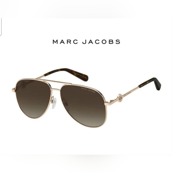 Aviator Marc Jacobs sunglass comes in a gold and brown frame with brown lens